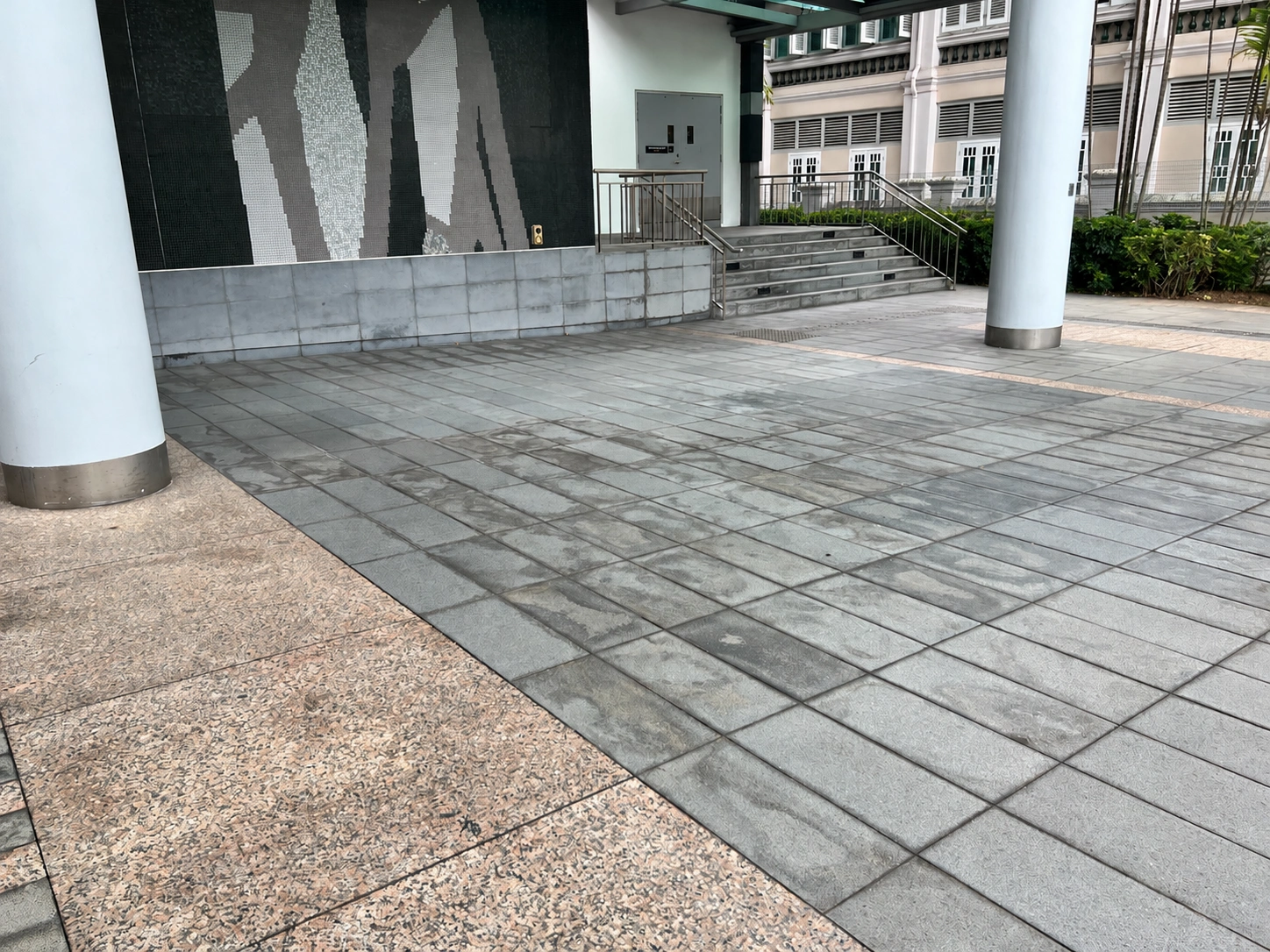 Before laser cleaning: stained granite paving at SMU LKC School of Business